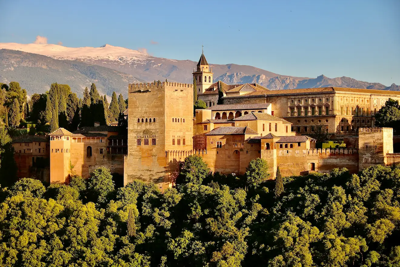 The Alhambra palace at golden hour with the Sierra Nevada behind, Granada